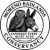 Moreno Badlands Conservancy logo featuring a wild donkey silhouette and burrowing owl