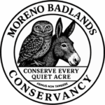 Moreno Badlands Conservancy logo featuring a wild donkey silhouette and burrowing owl